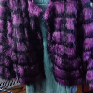 Step into the spotlight with this STUNNING purple & black never-worn faux fur!